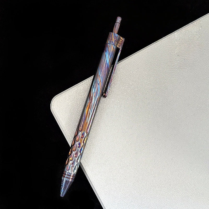 Damascus Tactical Pen – Titanium with CNC Engraved Titanium / Zirconium / Steel Writing detail image - detail view 10