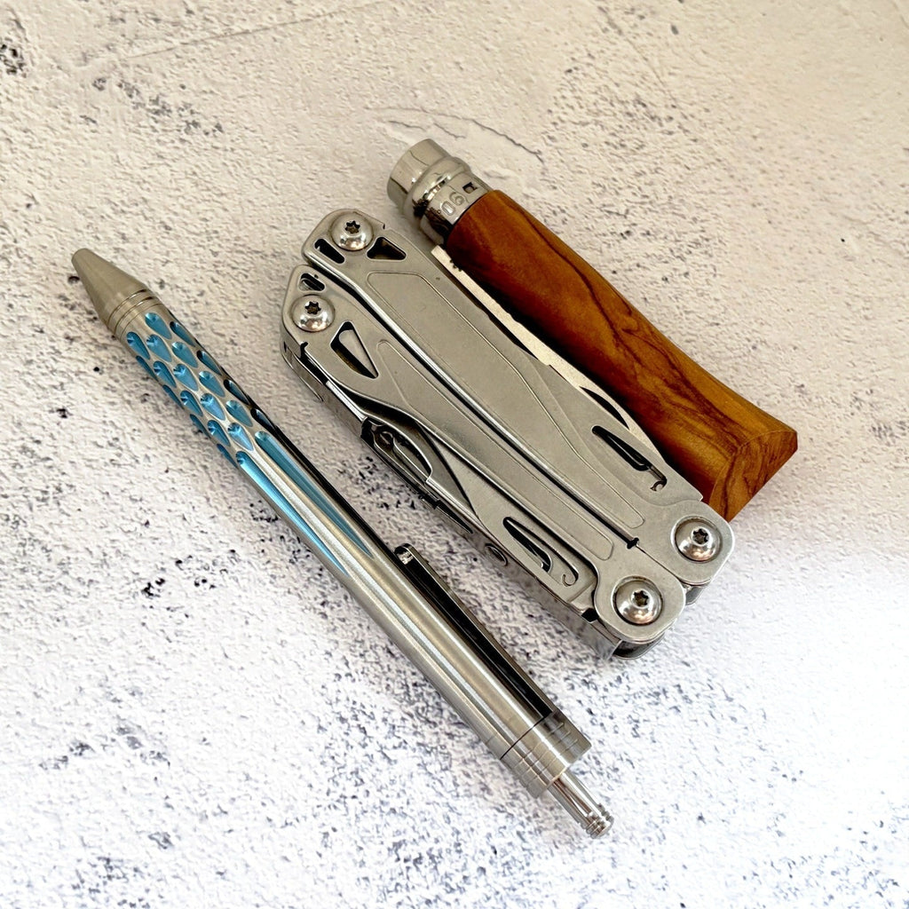 Damascus Tactical Pen – Titanium with CNC Engraved Titanium / Zirconium / Steel Writing detail image - detail view 5