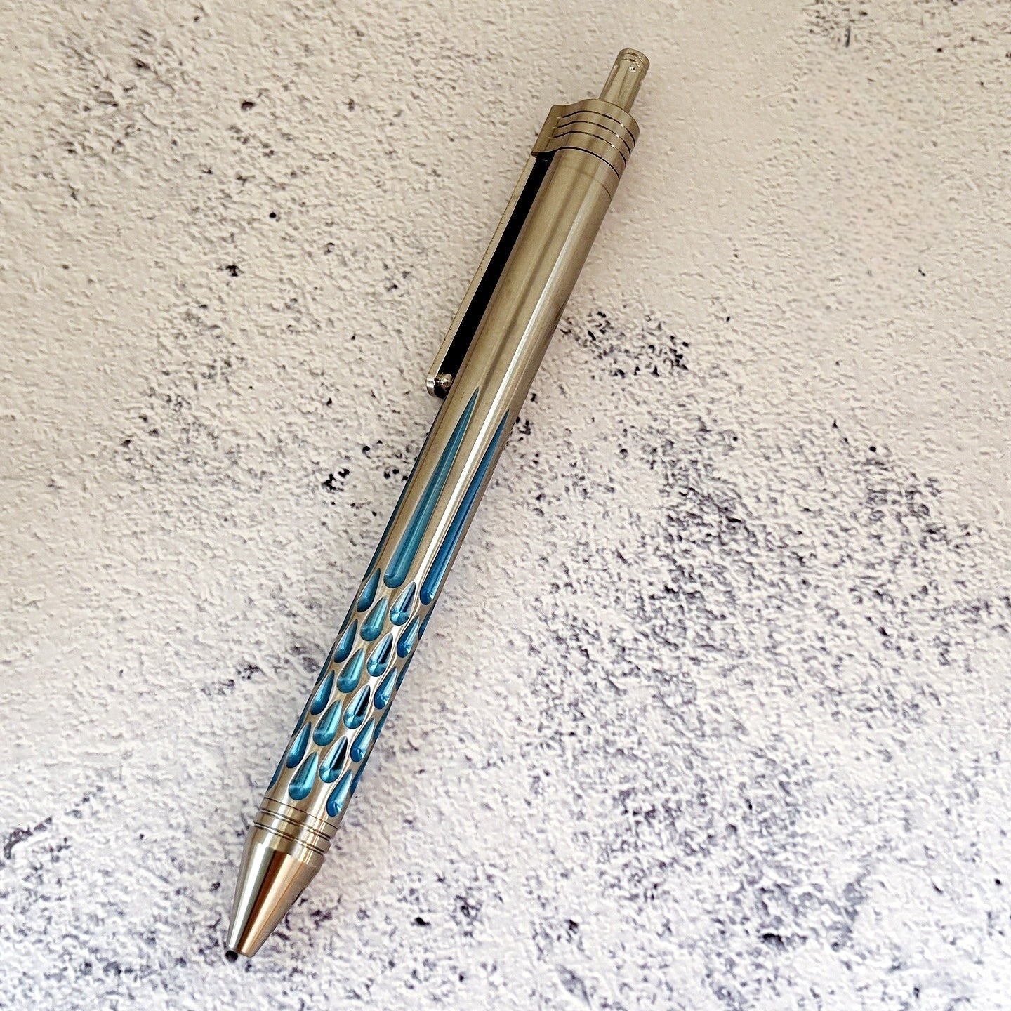 Damascus Tactical Pen – Titanium with CNC Engraved Titanium / Zirconium / Steel Writing detail image - detail view 7