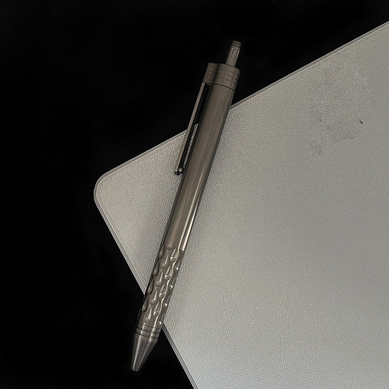 Damascus Tactical Pen – Titanium with CNC Engraved Titanium / Zirconium / Steel Writing detail image - detail view 9